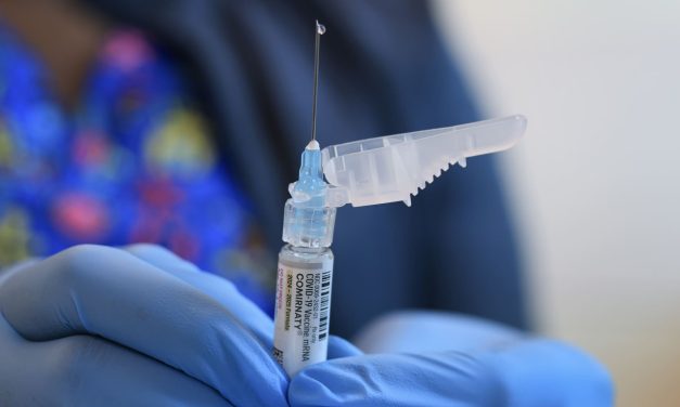 Covid Shot Access, cover at the game, while the vaccine panel by RFK Jr.